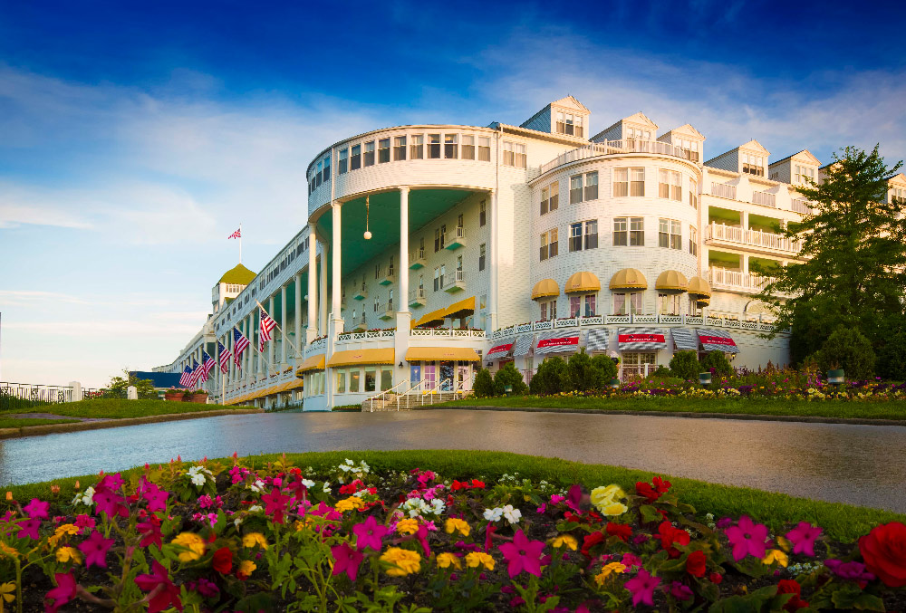 Image of the exterior of the Grand Hotel. Grand Hotel, a member of Historic Hotels since 2001, dates to 1886. It is located in Mackinac Island, Michigan.